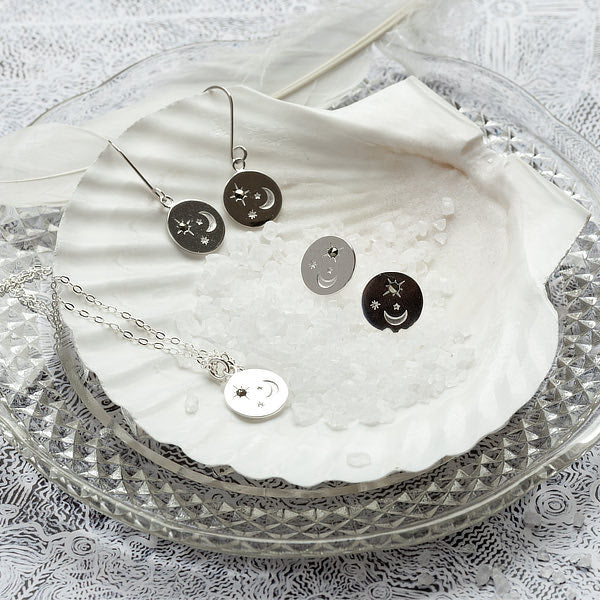 Matching jewellery set: moon and stars designs in sterling silver with marcasite gemstones.